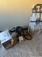 Group shot of cold therapy unit, humidifier box, blood pressure monitor box, walker