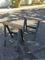 Pair of steel folding sawhorses front view