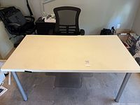 Top view of white desk, chair, and floor mat