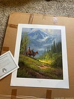 Full view of unframed print on cardboard with certificate visible