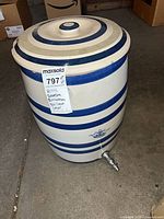 Full view of crock with lid, blue stripes, crown mark, spigot visible