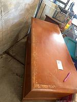 Top and side view of wooden chest showing size and wear