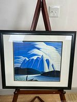 Full front view of framed artwork on easel