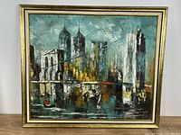 Full view of framed cityscape painting