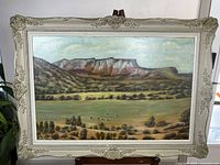 Full view of framed landscape painting
