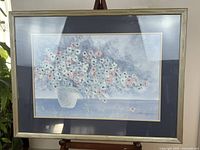 Front view of framed Stephen Kaye print with floral bouquet