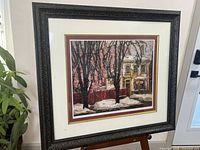 Full view of framed print on easel