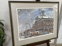 Full view of framed print on easel