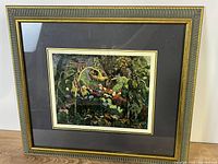 Front view of framed print showing artwork, matting, frame style