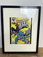 Front view of framed comic with mat and black frame