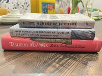 Stack of three New York books showing spines