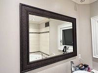 Full view of mirror mounted on wall