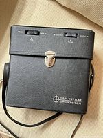 Front of Carl Wetzlar Sportster radio case showing controls and logo