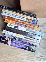 Stack of DVDs showing side spines of several titles
