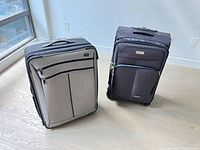 Both suitcases front view showing size and style