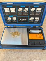 Chain coiled on digital scale displaying 1.92 g