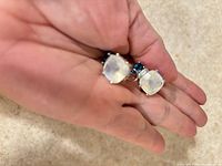 Pair of earrings showing moonstone and blue topaz stones