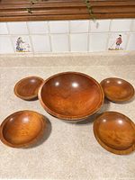 Top view of full 5-piece wooden bowl set