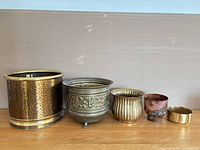 Group shot of all five brass and copper planters