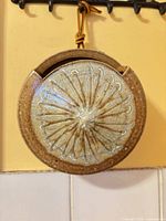 Front view showing starburst design and glaze