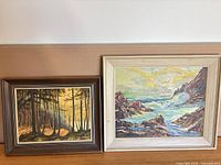 Both framed oil paintings side by side