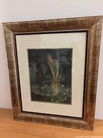 Full view of framed print on tabletop