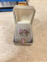 Earrings and ring displayed in jewellery box