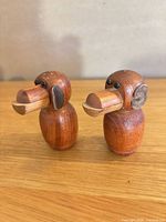 Front view of both teak monkey shakers