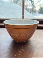 Exterior side view showing Woodland pattern and brown color