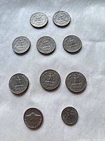 Back (reverse) sides of ten U.S. coins laid out on white background