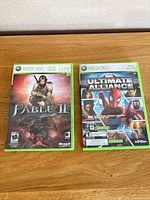 Fable II and Marvel Ultimate Alliance front cover cases