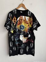 Front view of Def Leppard all-over print T-shirt on hanger