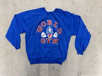 Front view of blue World Gym sweatshirt showing full graphic and condition