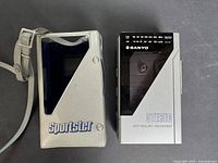 Front view of Sanyo cassette player beside Sportster case