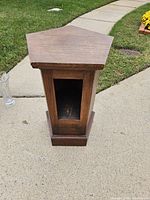 Full view of corner pedestal showing pentagonal top and open front