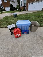 Group shot showing all five items: first aid kit, step stool, tote, trash can, TWA bag