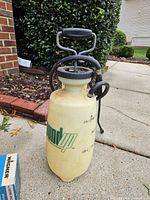 Roundup pump sprayer upright showing tank, handle, hose