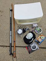 All items spread on pavement showing quantity and variety