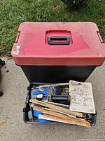 Totes stacked, contents visible in lower bin
