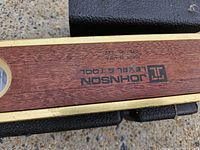 Close-up of Johnson Level & Tool marking on wood level