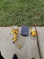 All three items laid out: work light, Simpson case, Sperry meter