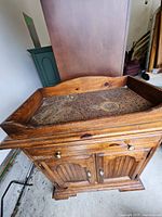 Front view showing cabinet, drawer, doors, copper top