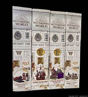 Front view of four sealed Harry Potter Wizarding World 3-D puzzle boxes with piece counts visible