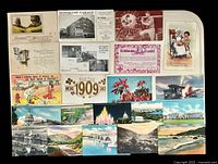 Fronts of mixed vintage postcards and greeting cards on tray
