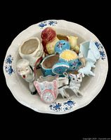 Top view of basin containing five animal planters