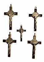 Front view of five crucifixes showing corpus and medal