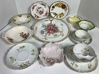 All ten china pieces arranged together