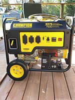 Full view of Champion generator showing frame, wheels, control panel and coiled cord