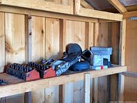 Shelf with cylinder heads, hoses, fan, case