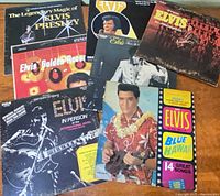 All seven Elvis Presley LPs spread out showing front covers